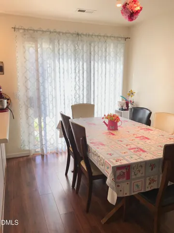 a dining room with a table and chairs