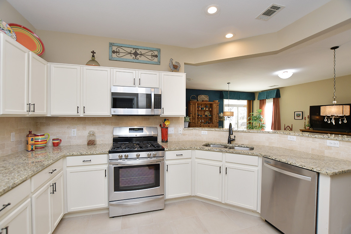 212 Bonham Loop Georgetown, TX 78633 - Photo 11 of 21 it's so easy to be a part of what is going on in the living/dining area from this open kitchen.