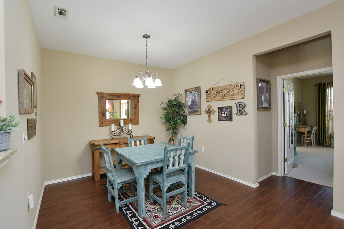 212 Bonham Loop Georgetown, TX 78633 - Photo 13 of 21 Off the living area, an intimate dining area is contiguous to the kitchen.