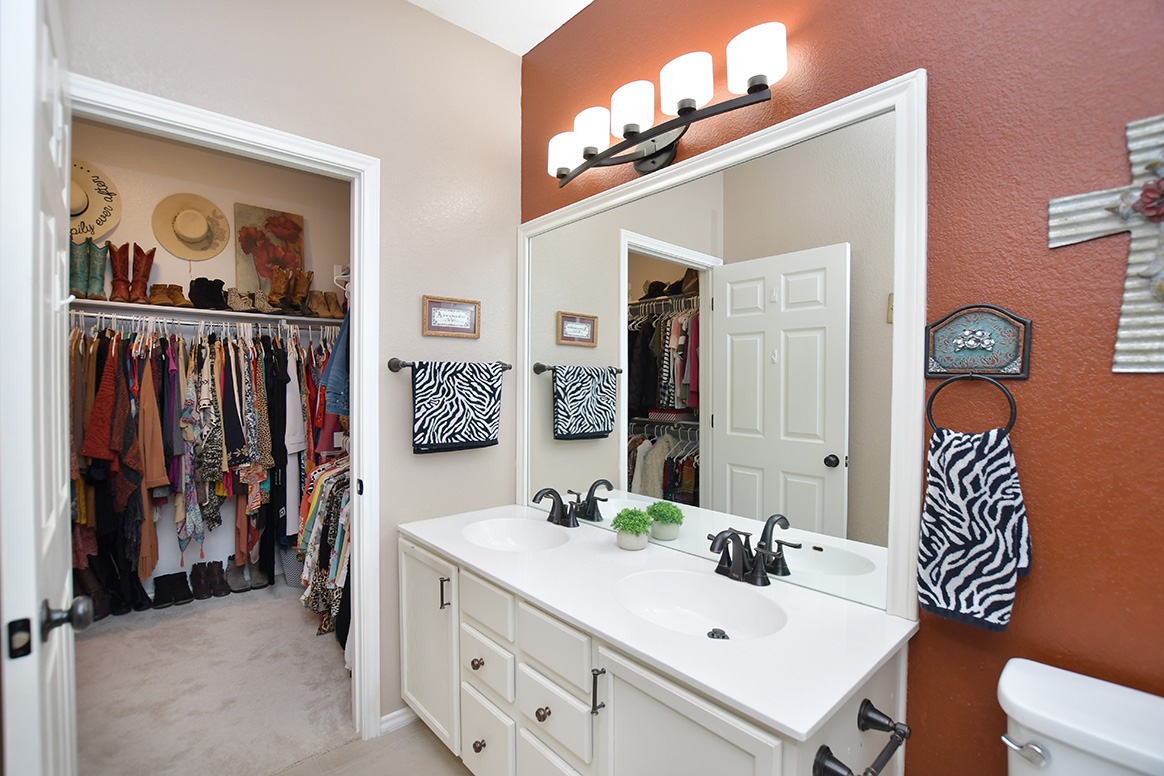 212 Bonham Loop Georgetown, TX 78633 - Photo 17 of 21 Gearing up or winding down your day is easy in the primary bath with large framed mirror and nearby walk-in closet.