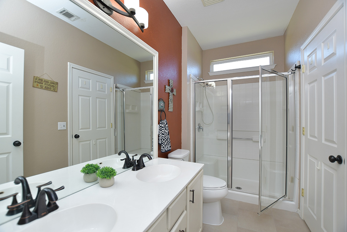 212 Bonham Loop Georgetown, TX 78633 - Photo 18 of 21 Efficient double sinks and a standalone shower are ready to assist - mornings and evenings.