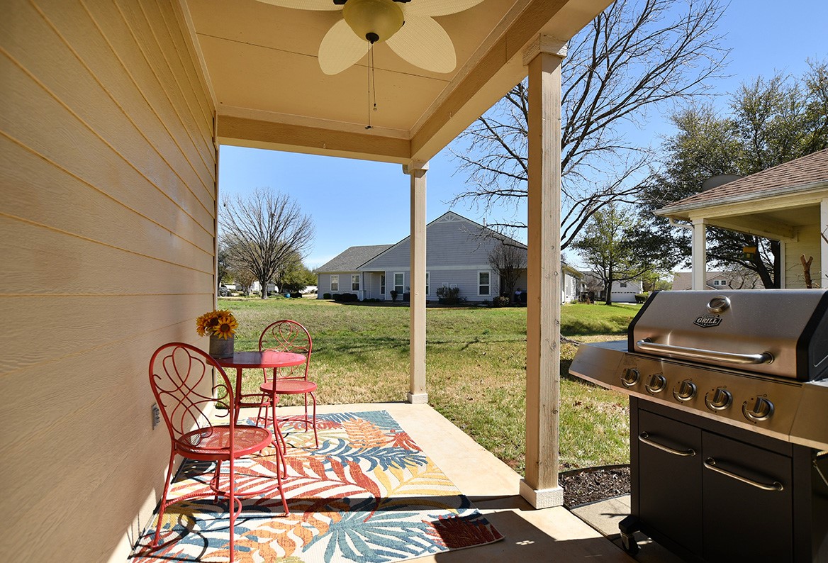 212 Bonham Loop Georgetown, TX 78633 - Photo 20 of 21 A convenient stone pad for a grill has been added off the covered patio.