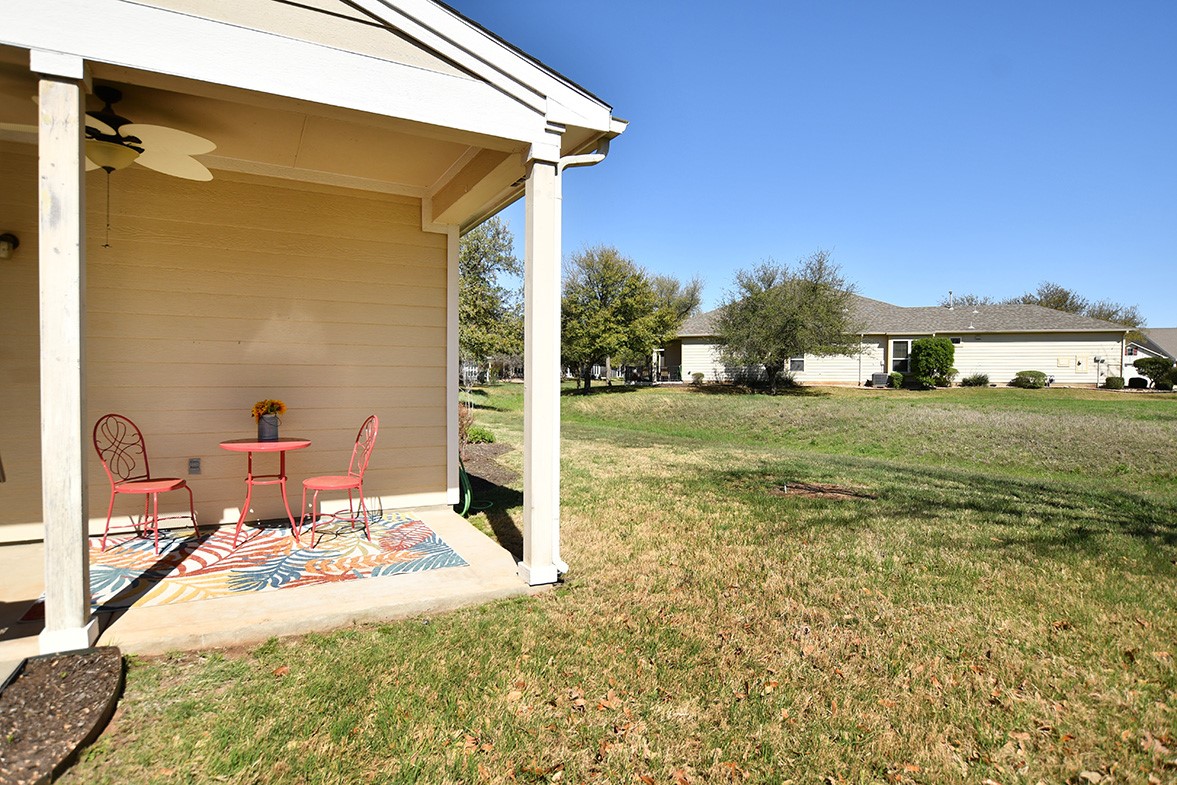 212 Bonham Loop Georgetown, TX 78633 - Photo 21 of 21 A glimpse of the open space behind this cute home is seen here.