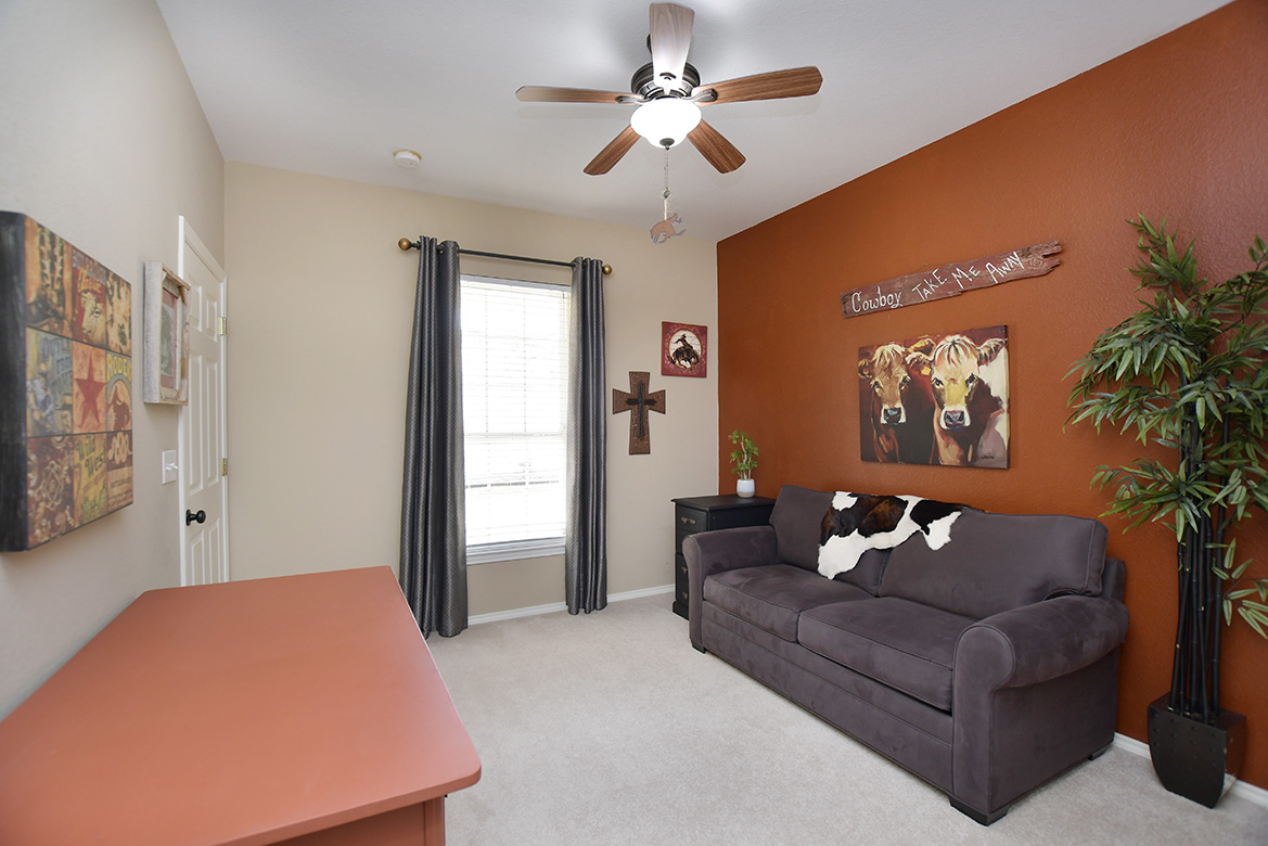 212 Bonham Loop Georgetown, TX 78633 - Photo 5 of 21 At the front of the home, off the entry, is the guest bedroom & bath with newly installed carpet.
