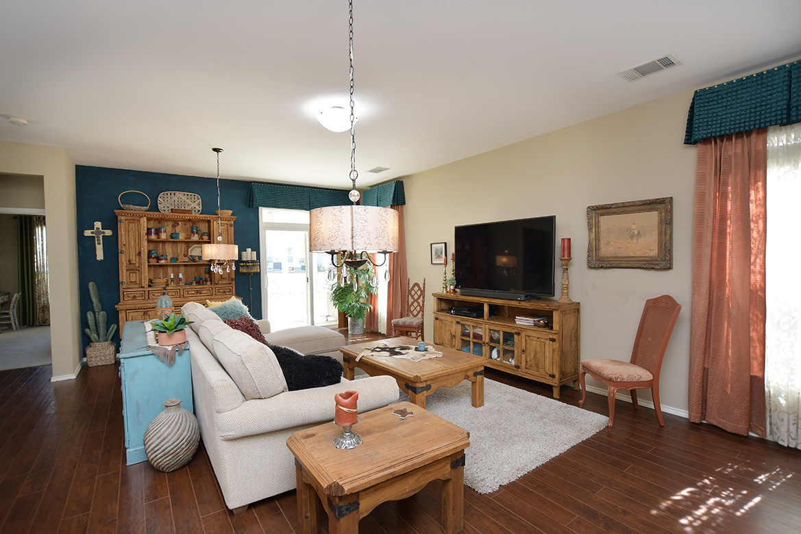 212 Bonham Loop Georgetown, TX 78633 - Photo 8 of 21 A full-view sliding door at the rear of the living area along with two windows allows in plentiful natural light.