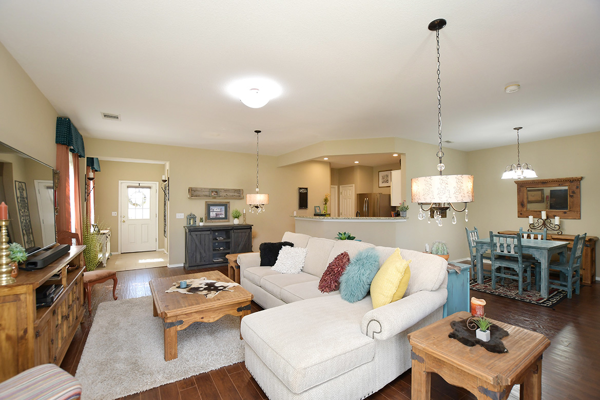 212 Bonham Loop Georgetown, TX 78633 - Photo 9 of 21 The open living area offers generous wall space on two sides for your favorite furniture pieces.