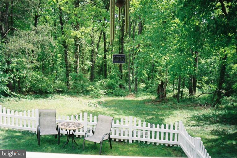 7853 Sellner Road Jessup, MD 20794 - Photo 26 of 28 Steps from deck to picket fenced back yard