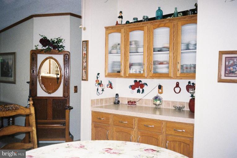 7853 Sellner Road Jessup, MD 20794 - Photo 9 of 28 Built-in cabinets in dining area