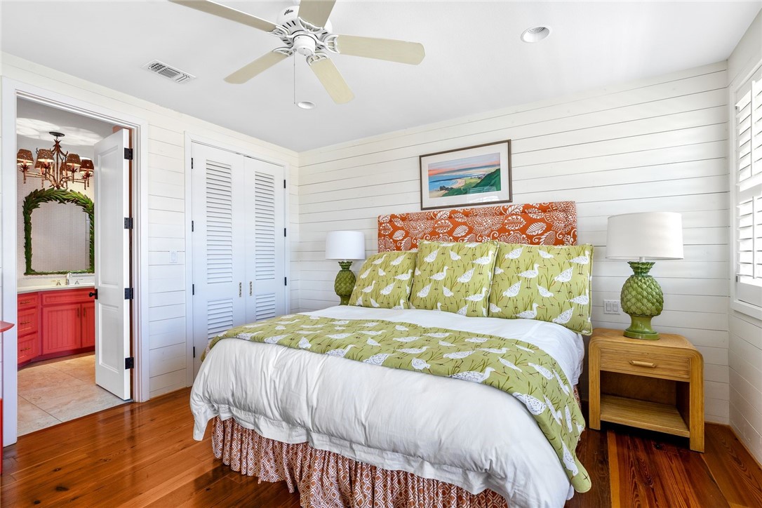 1024 Private Road East Port Aransas, TX 78373 - Photo 12 of 40 a bedroom with a bed and a couch