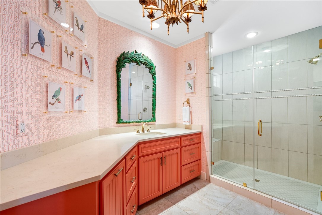 1024 Private Road East Port Aransas, TX 78373 - Photo 14 of 40 a spacious bathroom with a sink a mirror and a shower