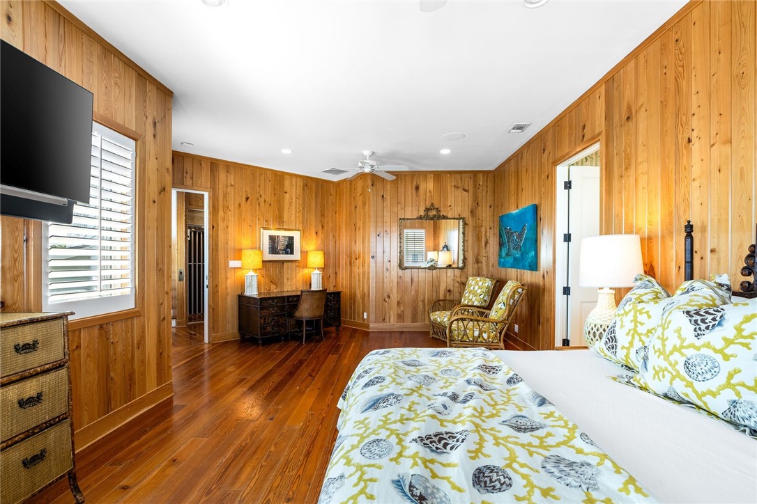 1024 Private Road East Port Aransas, TX 78373 - Photo 19 of 40 a bedroom with furniture and a bed