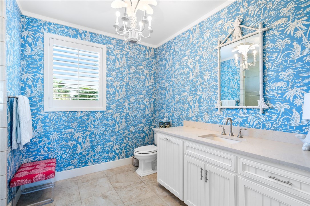 1024 Private Road East Port Aransas, TX 78373 - Photo 20 of 40 a bathroom with a sink a toilet and mirror