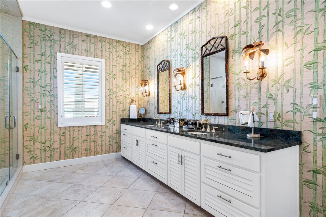 1024 Private Road East Port Aransas, TX 78373 - Photo 22 of 40 a bathroom with double sink and a mirror