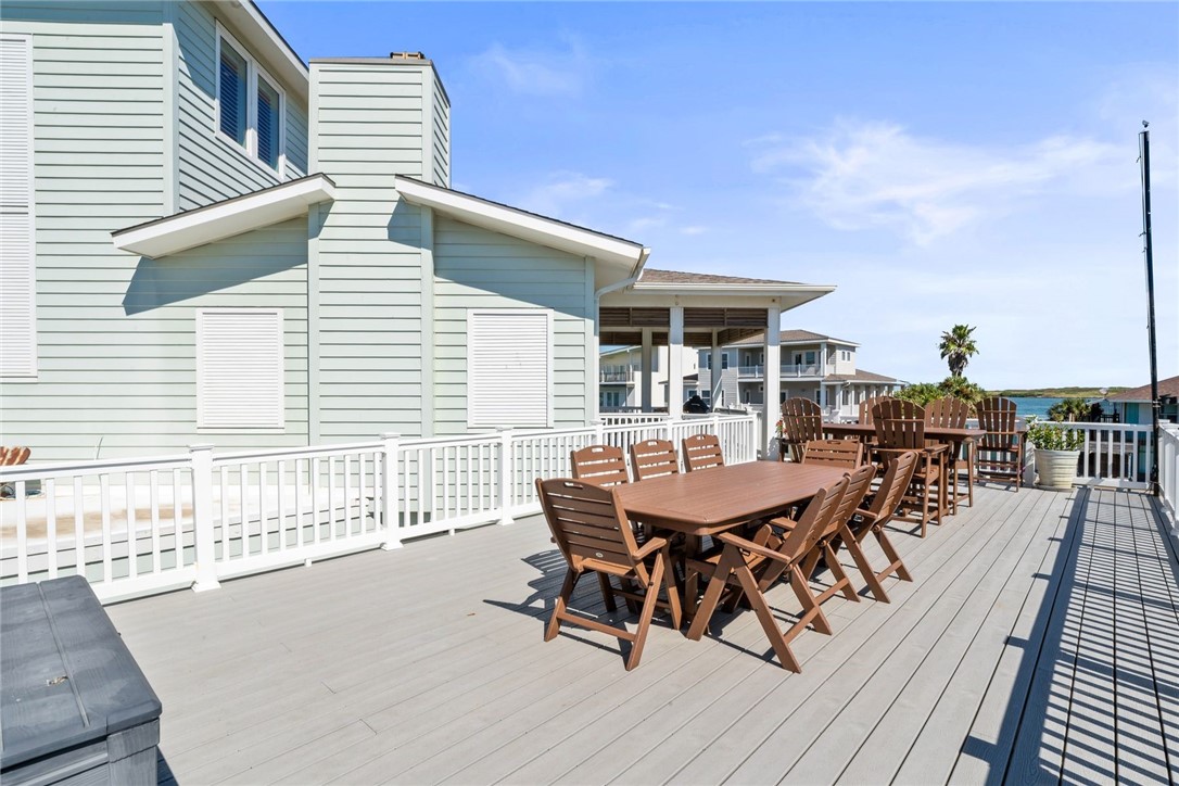 1024 Private Road East Port Aransas, TX 78373 - Photo 27 of 40 a roof deck with a table and chairs