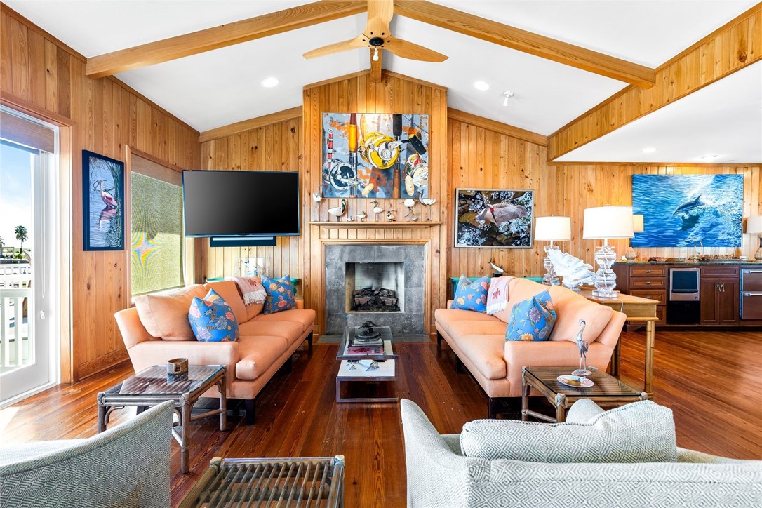 1024 Private Road East Port Aransas, TX 78373 - Photo 8 of 40 a living room with fireplace furniture and a flat screen tv