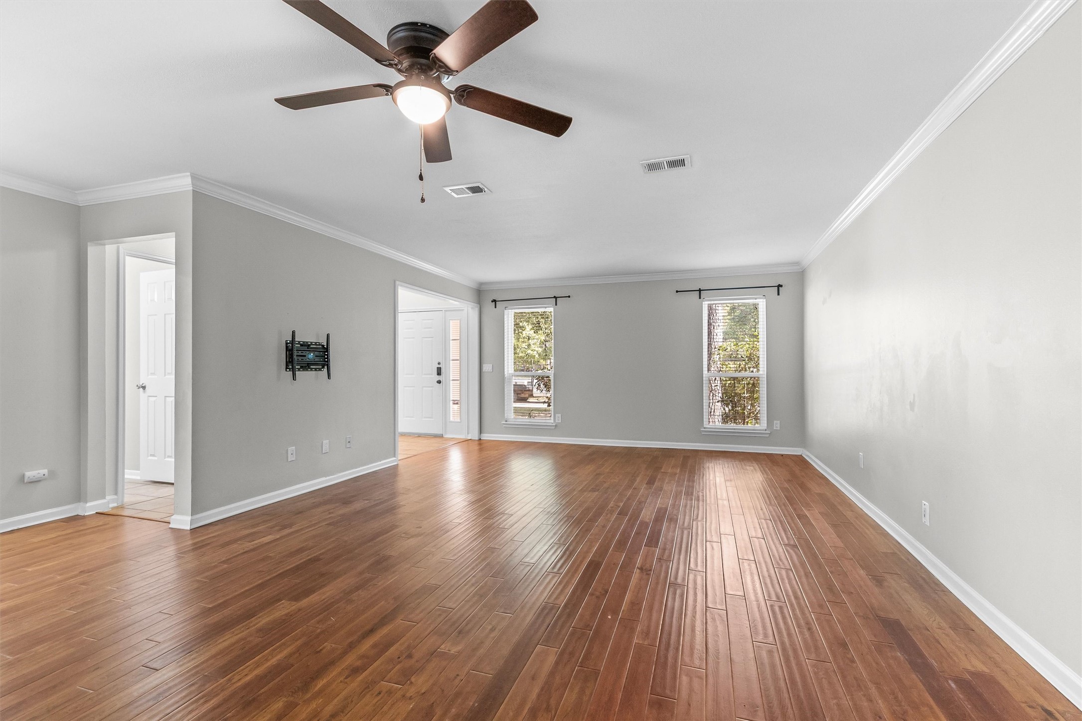 This living room is very large. Sellers used as a formal dining room and living room area.