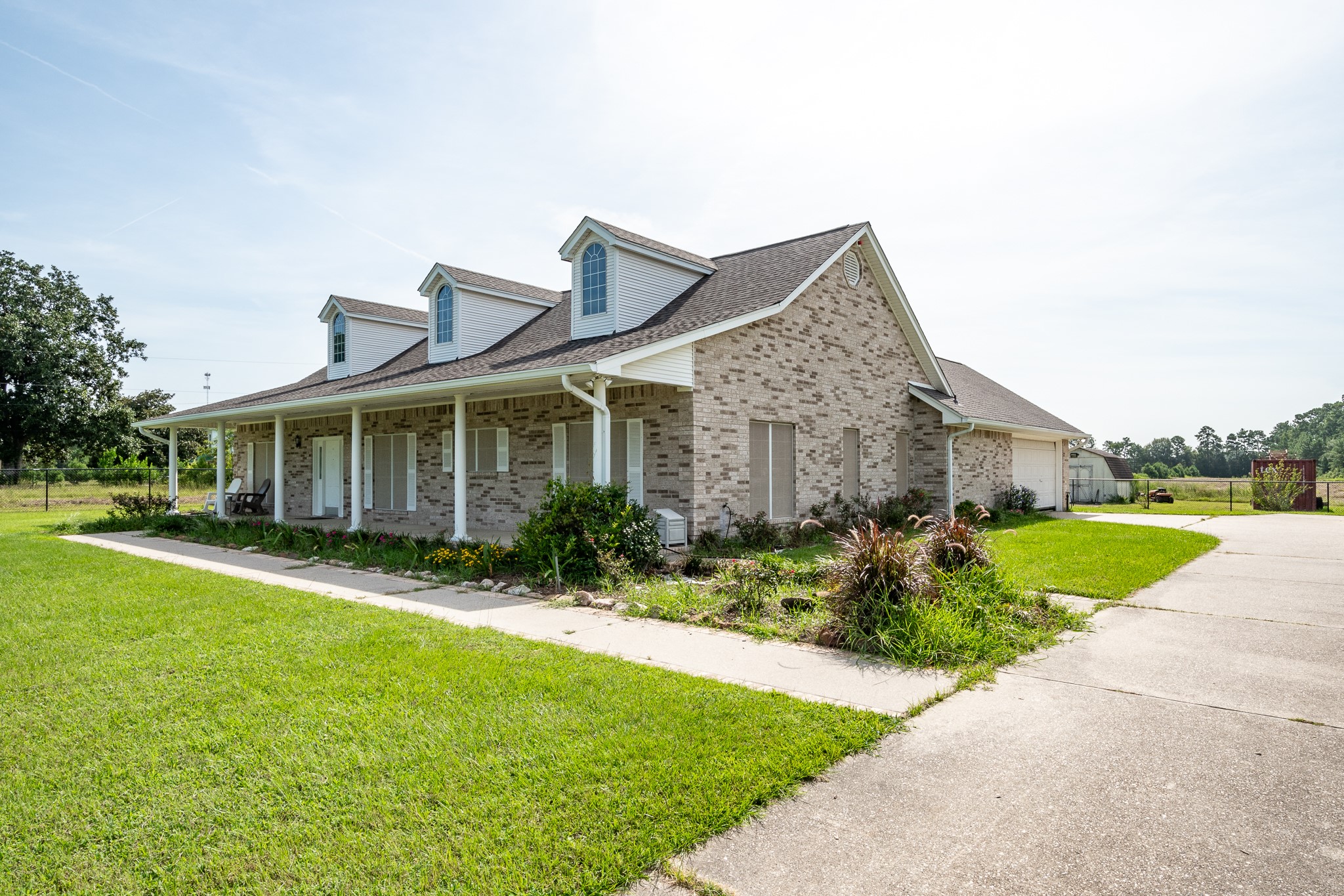 15953 1st Street Splendora, TX 77372 - Photo 15 of 23 a front view of house with yard and green space