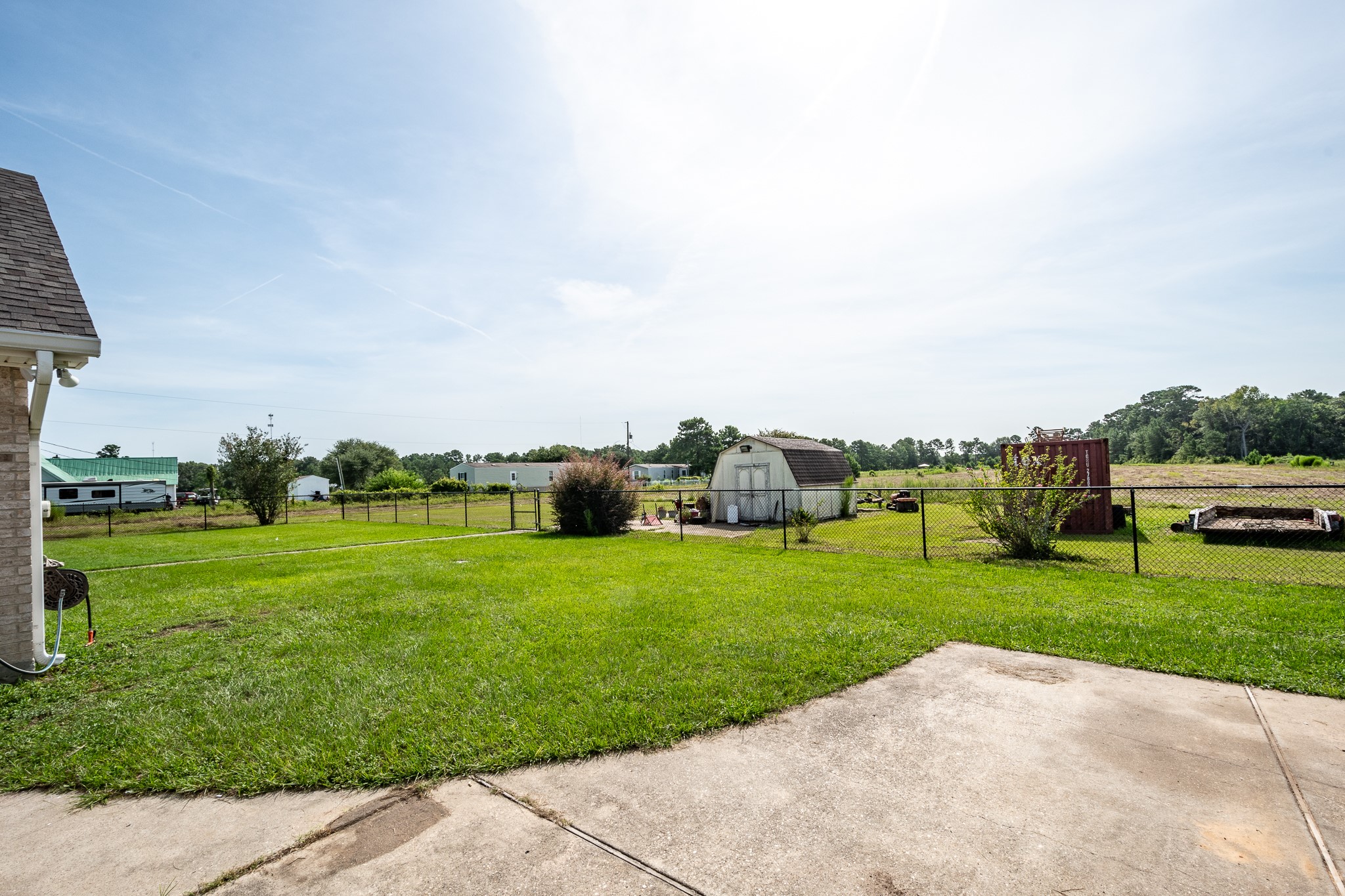 15953 1st Street Splendora, TX 77372 - Photo 17 of 23 a view of a grassy field with grass