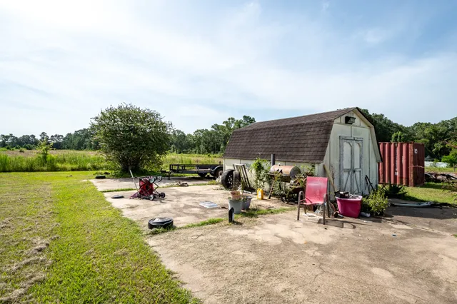 a view of a patio with a table and chairs