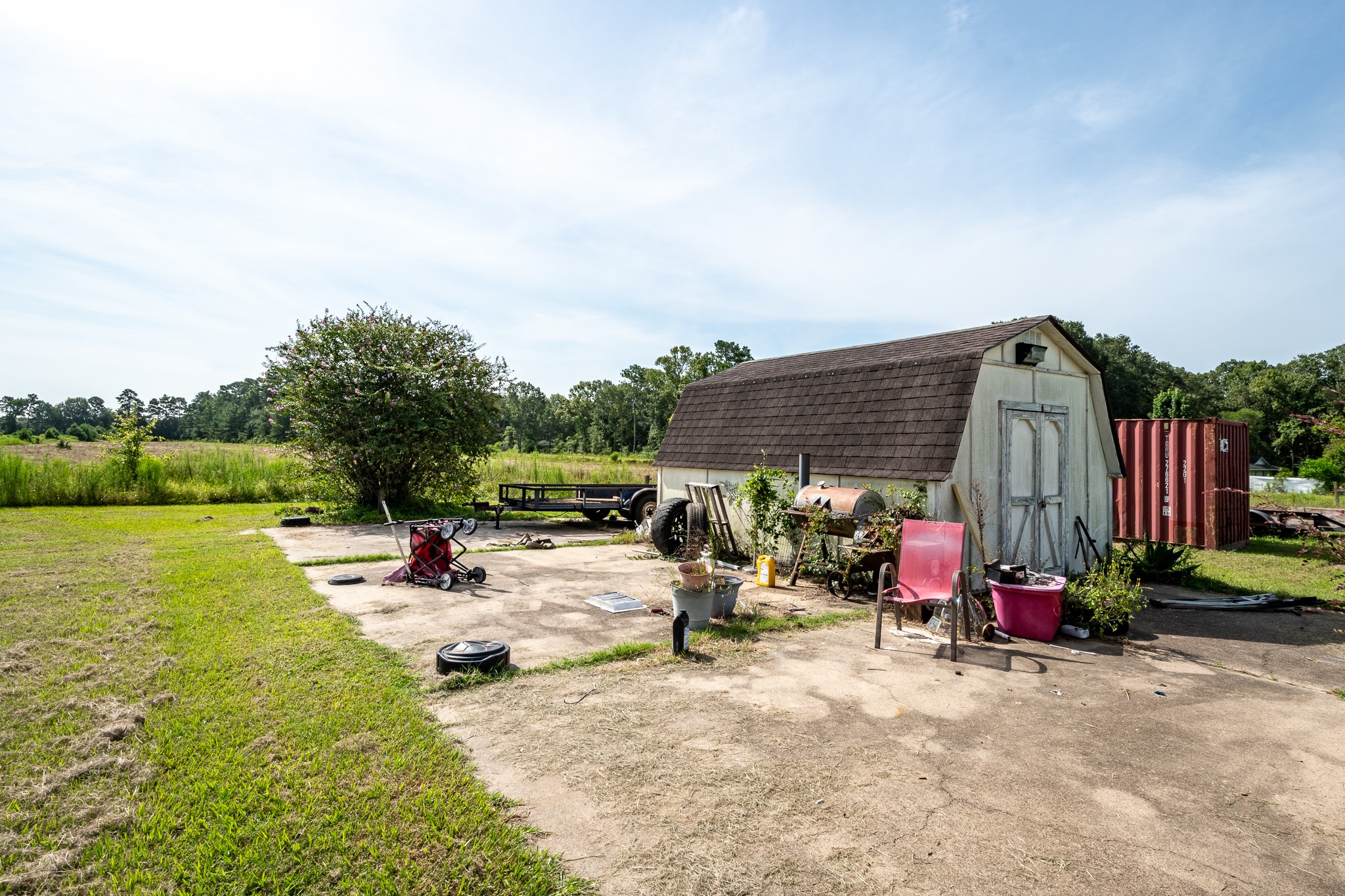 15953 1st Street Splendora, TX 77372 - Photo 19 of 23 a view of a patio with a table and chairs