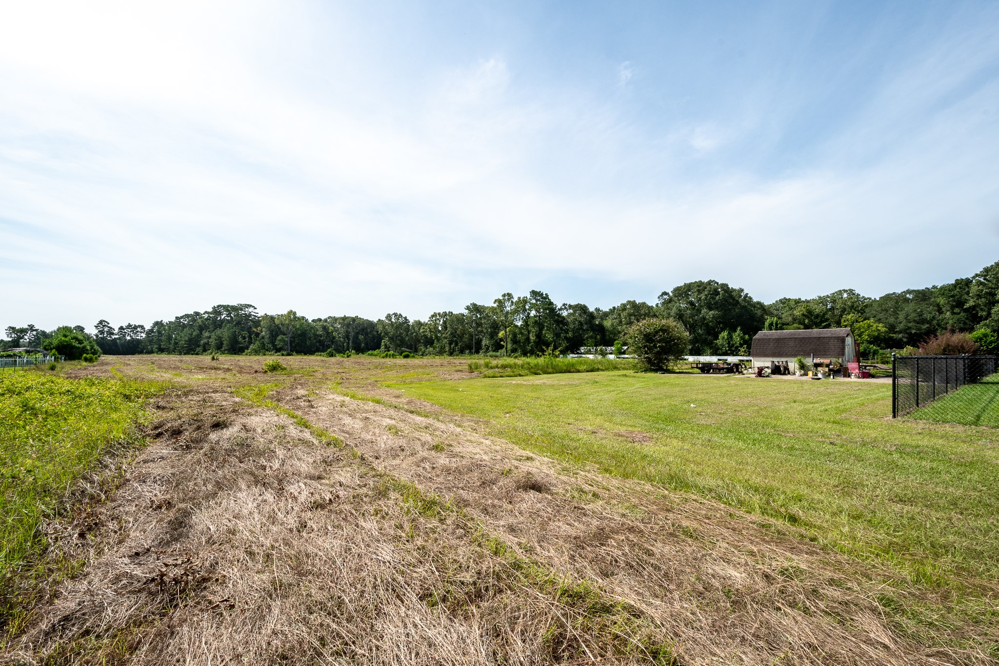 15953 1st Street Splendora, TX 77372 - Photo 20 of 23 a view of a lake with houses in the back