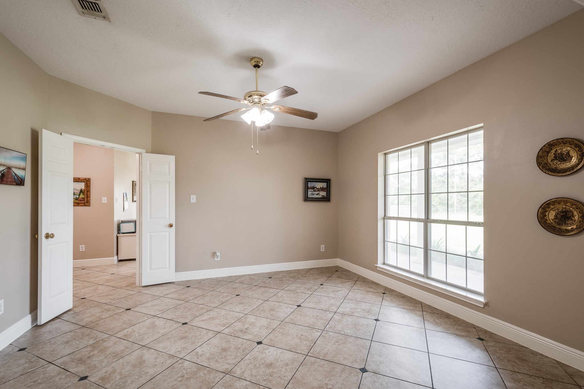 15953 1st Street Splendora, TX 77372 - Photo 6 of 23 a view of an empty room with a window