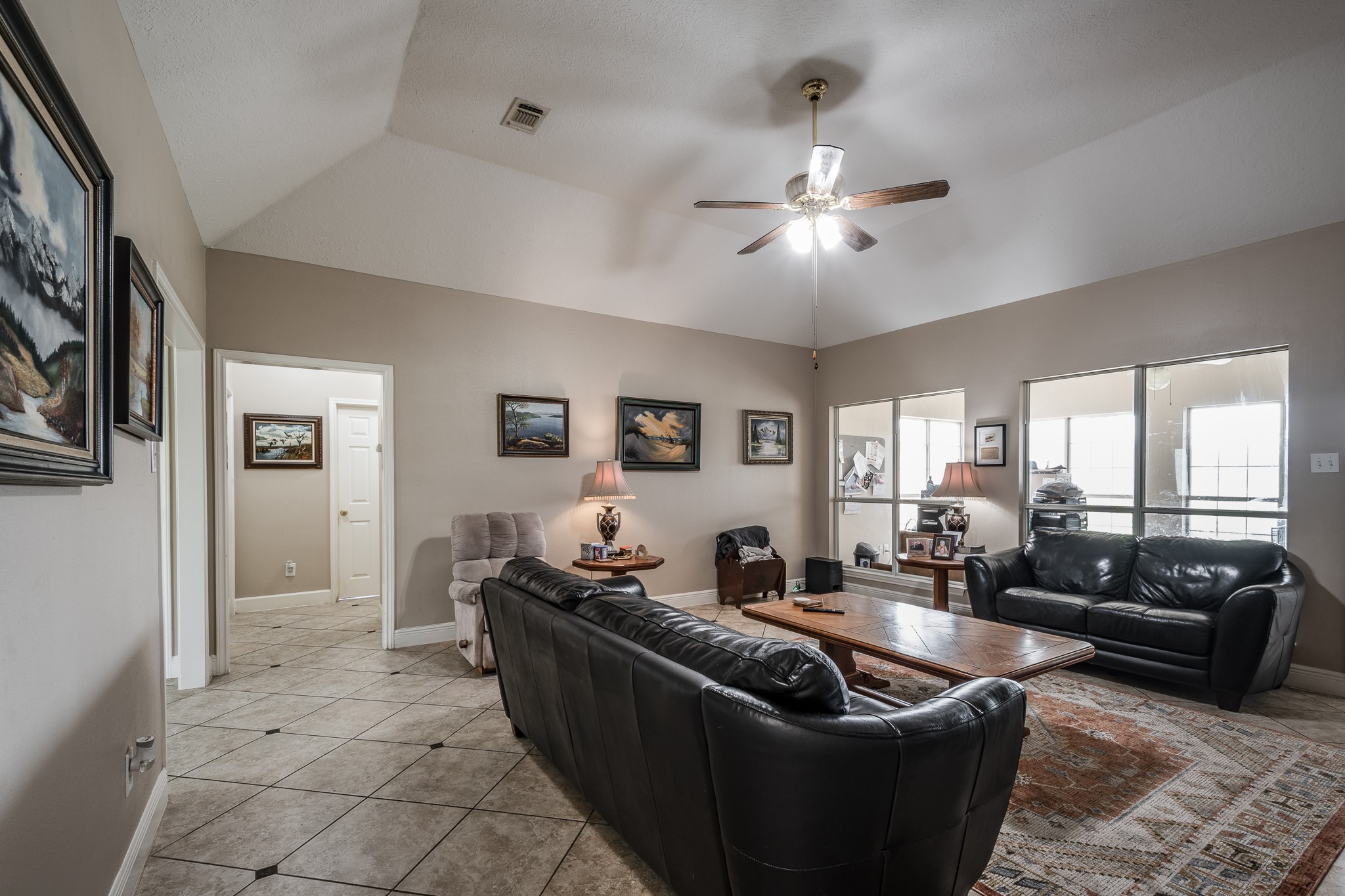 15953 1st Street Splendora, TX 77372 - Photo 8 of 23 a living room with furniture and a large window