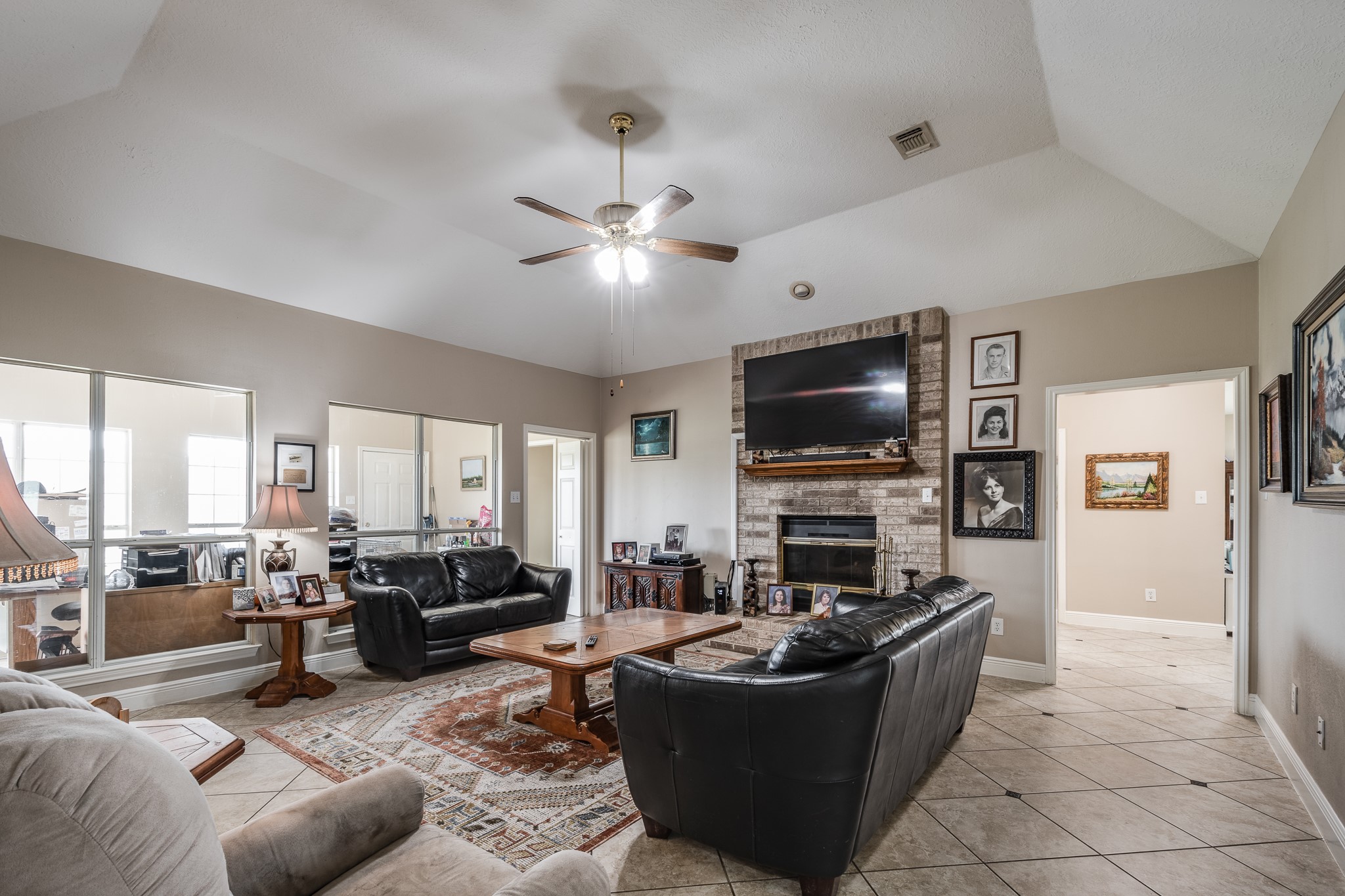 15953 1st Street Splendora, TX 77372 - Photo 9 of 23 a living room with furniture and a flat screen tv