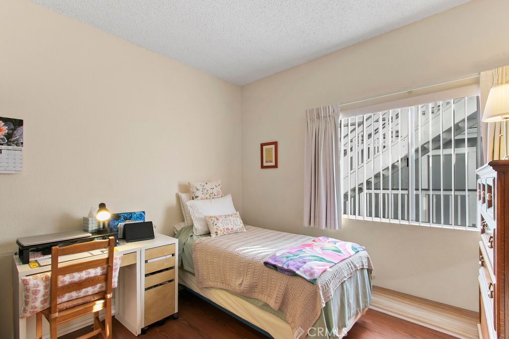10411 Garden Grove Boulevard, Unit 43 Garden Grove, CA 92843 - Photo 11 of 22 a bedroom with a bed and a window