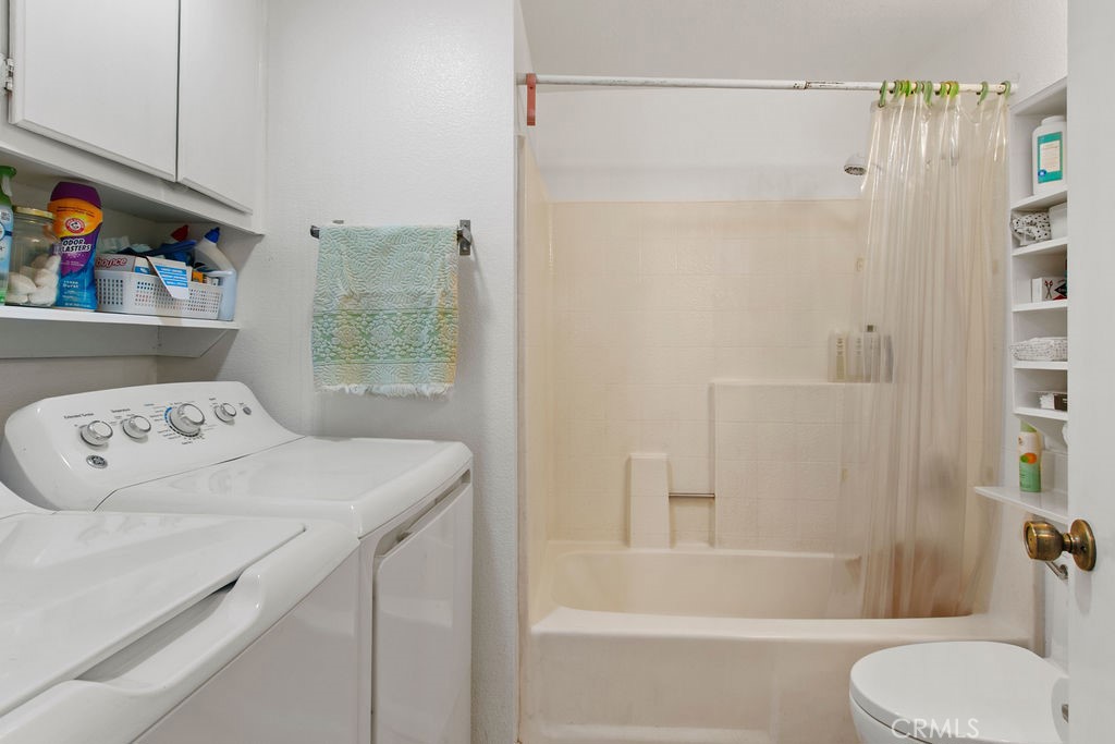 10411 Garden Grove Boulevard, Unit 43 Garden Grove, CA 92843 - Photo 12 of 22 a bathroom with a sink a toilet and shower