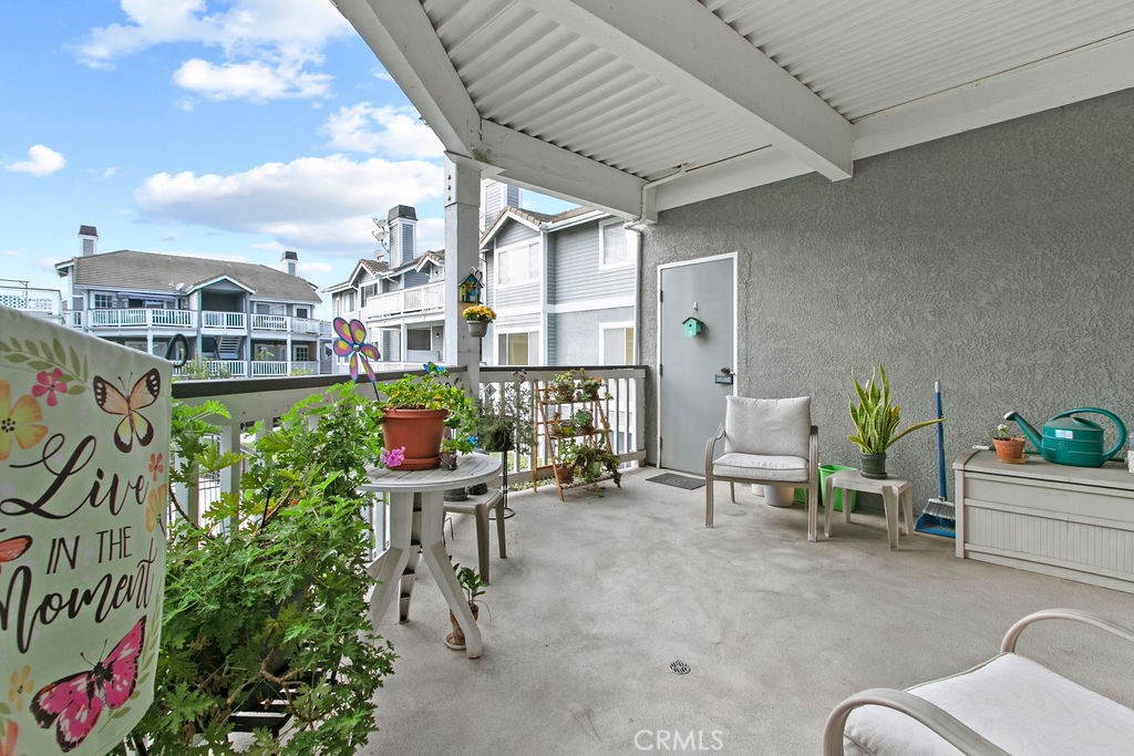 10411 Garden Grove Boulevard, Unit 43 Garden Grove, CA 92843 - Photo 14 of 22 a view of a patio with couches table and chairs and potted plants