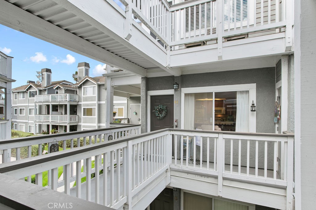 10411 Garden Grove Boulevard, Unit 43 Garden Grove, CA 92843 - Photo 16 of 22 a view of a brick building from a balcony