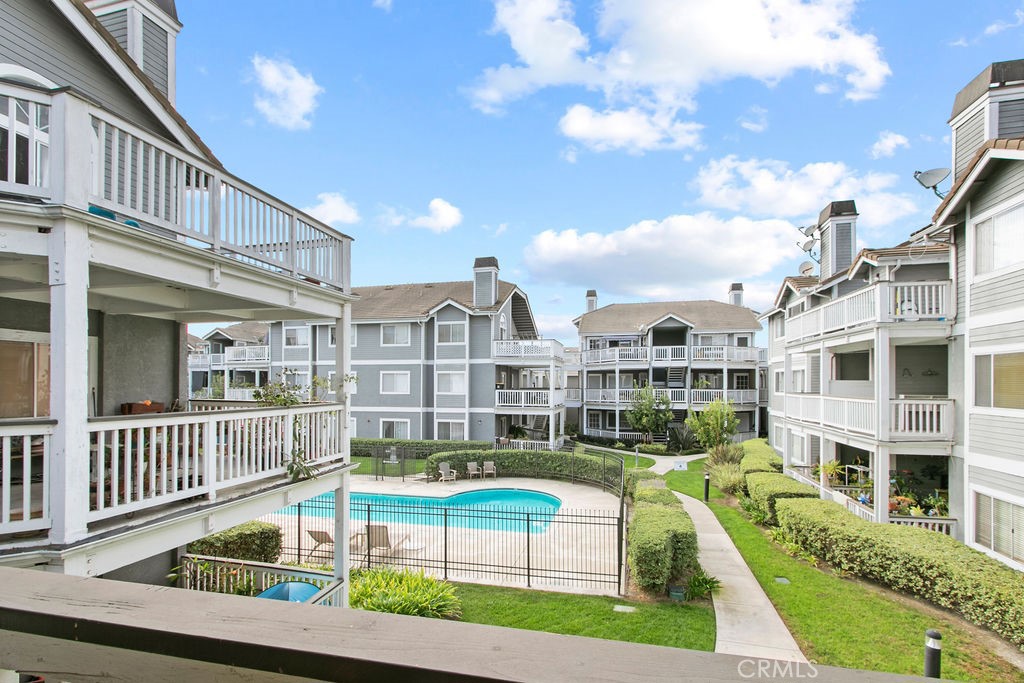 10411 Garden Grove Boulevard, Unit 43 Garden Grove, CA 92843 - Photo 18 of 22 a view of a house with a swimming pool and sitting area