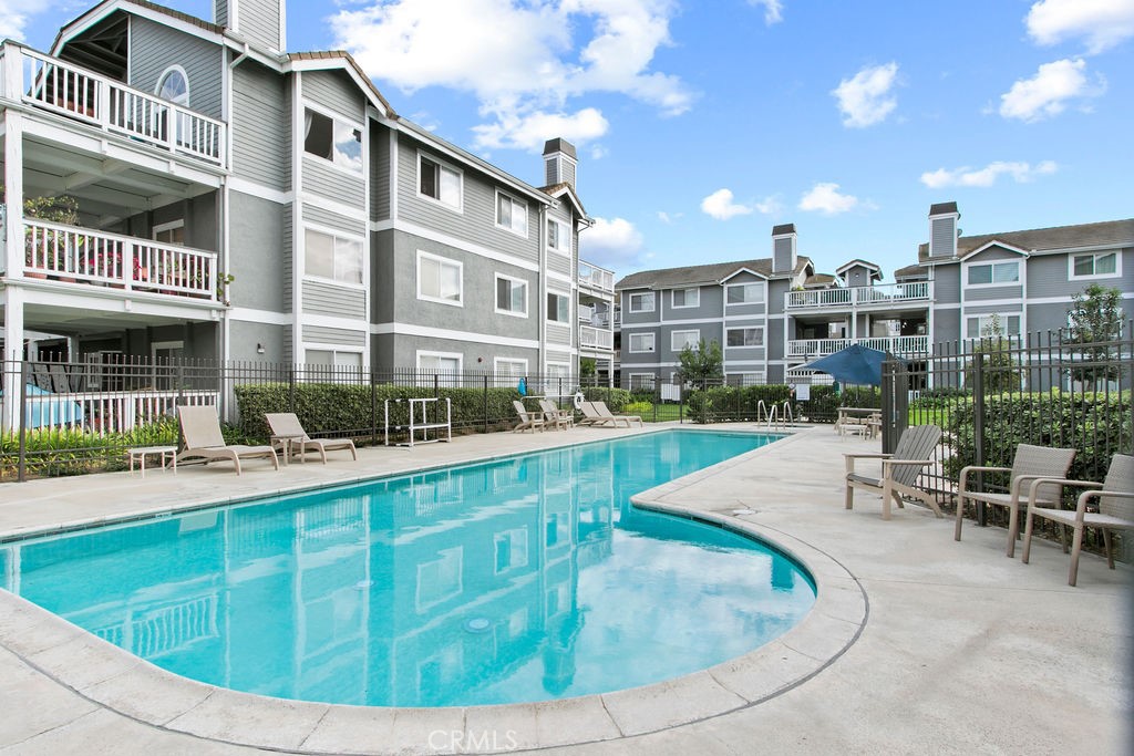 10411 Garden Grove Boulevard, Unit 43 Garden Grove, CA 92843 - Photo 19 of 22 a view of a swimming pool with outdoor seating