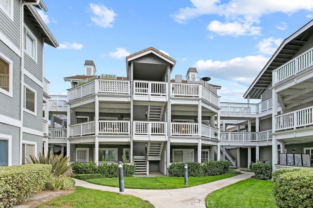 10411 Garden Grove Boulevard, Unit 43 Garden Grove, CA 92843 - Photo 21 of 22 a front view of a building with a yard