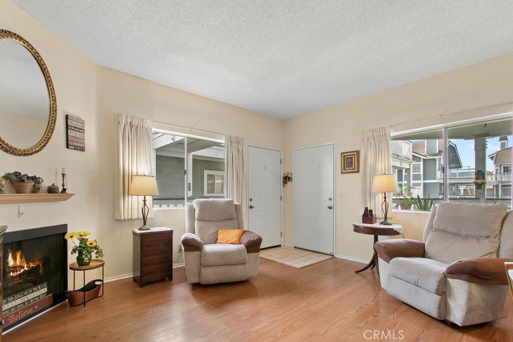 10411 Garden Grove Boulevard, Unit 43 Garden Grove, CA 92843 - Photo 3 of 22 a living room with furniture and a fireplace