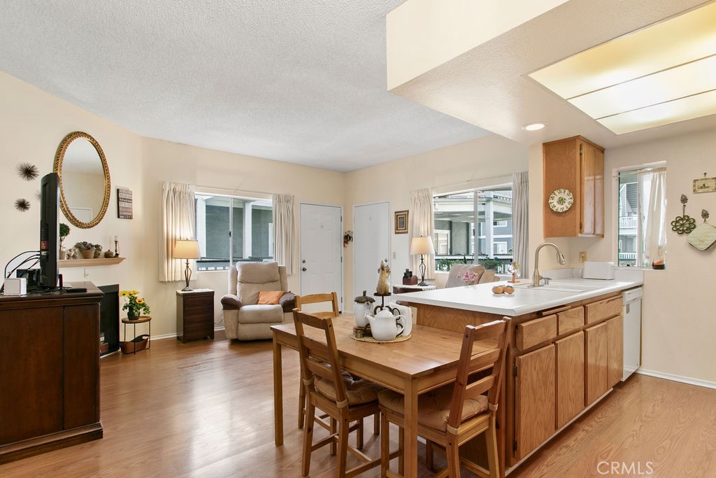10411 Garden Grove Boulevard, Unit 43 Garden Grove, CA 92843 - Photo 4 of 22 a view of a a dining room with furniture window and wooden floor