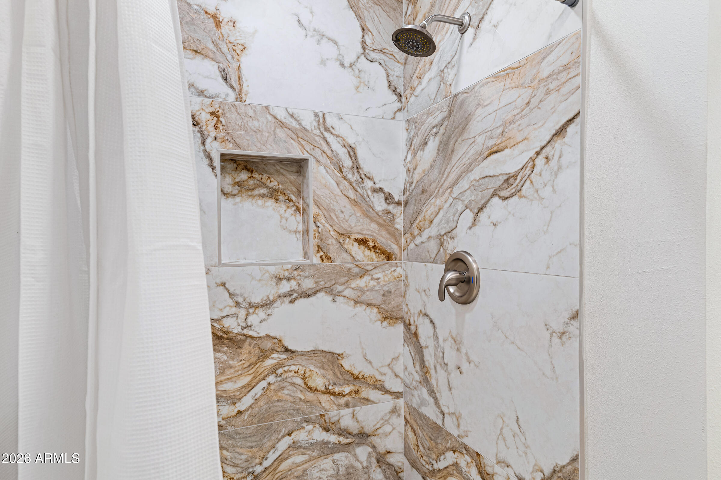 3921 South Kenneth Place Tempe, AZ 85282 - Photo 28 of 43 a bathroom with a bathtub and shower