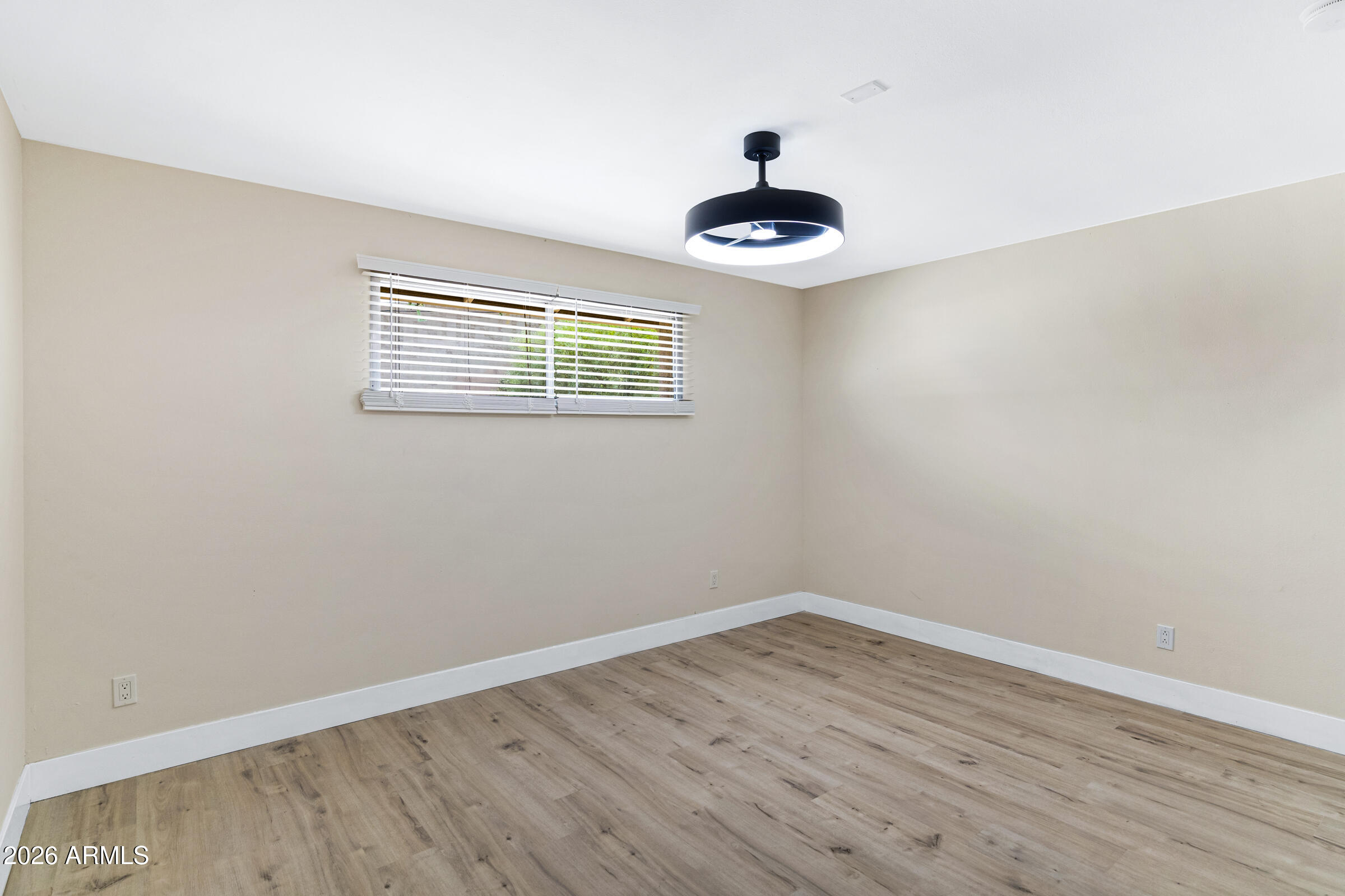 3921 South Kenneth Place Tempe, AZ 85282 - Photo 29 of 43 a view of an empty room with a window
