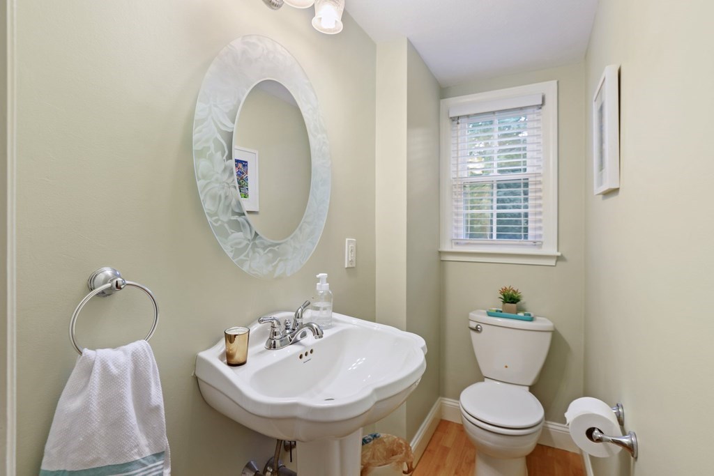 23 Clough Road, Unit 23 Dedham, MA 02026 - Photo 15 of 27 a bathroom with a toilet sink and mirror