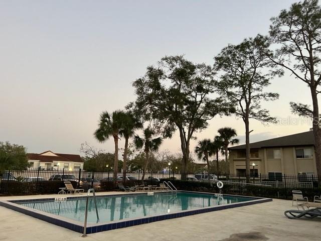 6112 Curry Ford Road, Unit 122 Orlando, FL 32822 - Photo 1 of 1 a view of a swimming pool with a patio
