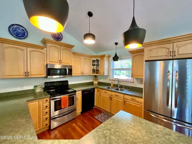 a view of living room with furniture and a large window