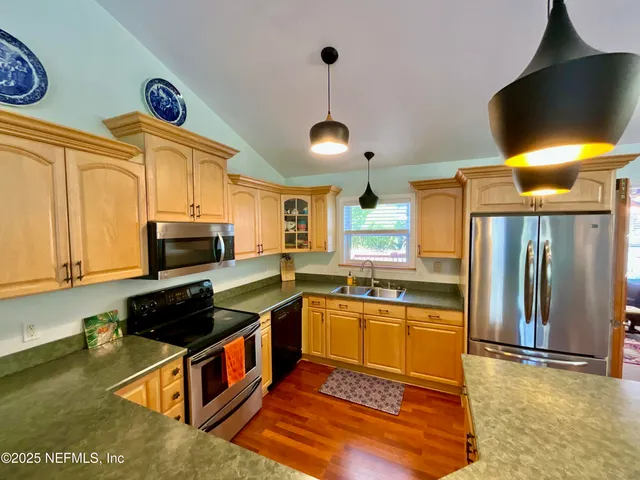 a living room with furniture rug and window