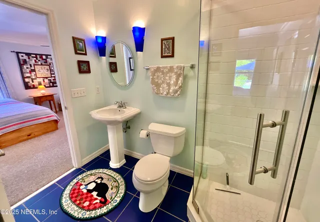 a view of a livingroom with furniture and a flat screen tv