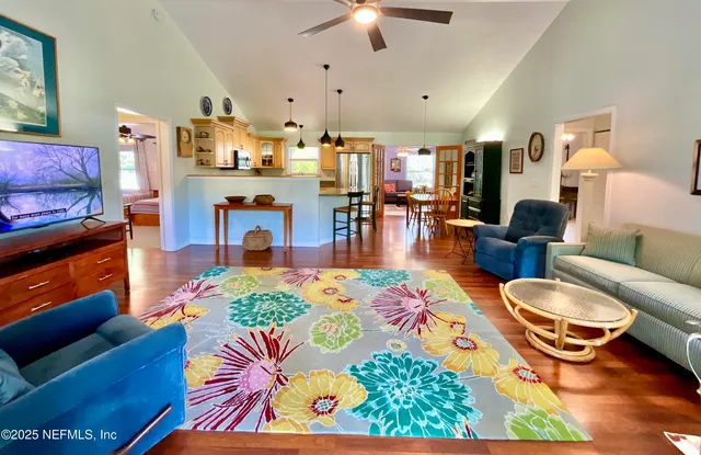 a living room with furniture and a rug