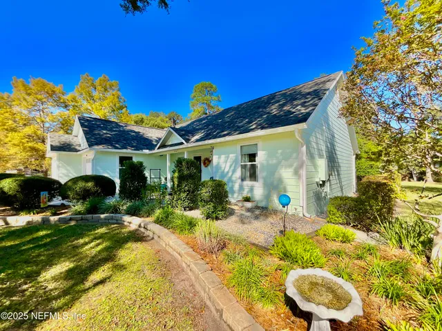 a view of house with garden