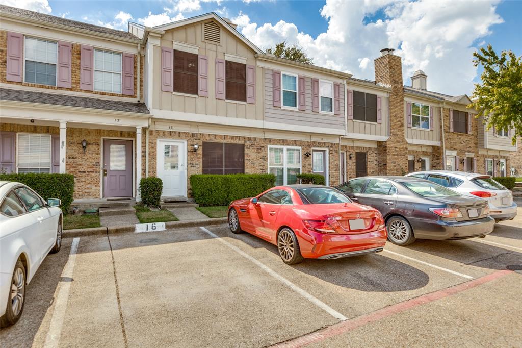 a front view of a house with parking space