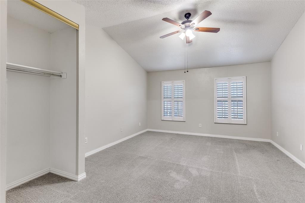 633 Carriagehouse Lane, Unit I6 Garland, TX 75040 - Photo 12 of 24 a view of an empty room with a window
