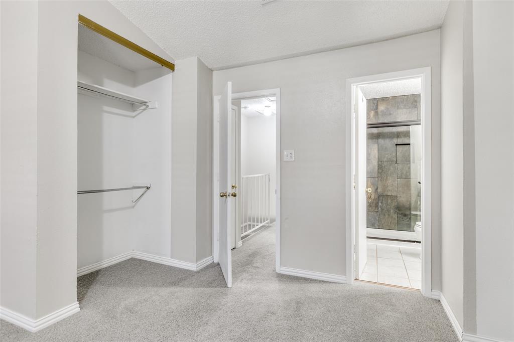 633 Carriagehouse Lane, Unit I6 Garland, TX 75040 - Photo 13 of 24 a view of an empty room with closet and a window