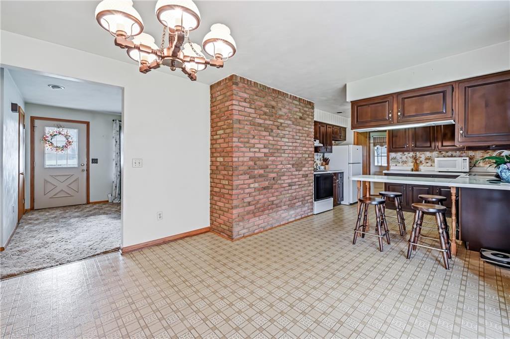 2635 South Keel Ridge Road Hermitage, PA 16148 - Photo 13 of 49 a view of a dining room with furniture and chandelier